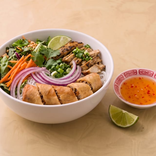 Grilled Lemongrass Chicken and Egg Roll Vermicelli Bowl.